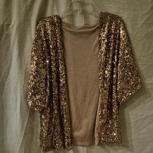 Elegant Gold Sequin Wrap most sizes, fits me with room and i am a 2x